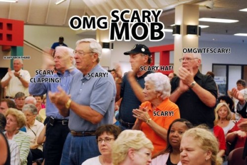 Look at the local mob attending the St. Louis town hall rallies.They look fishy to me..jpg (60 KB)